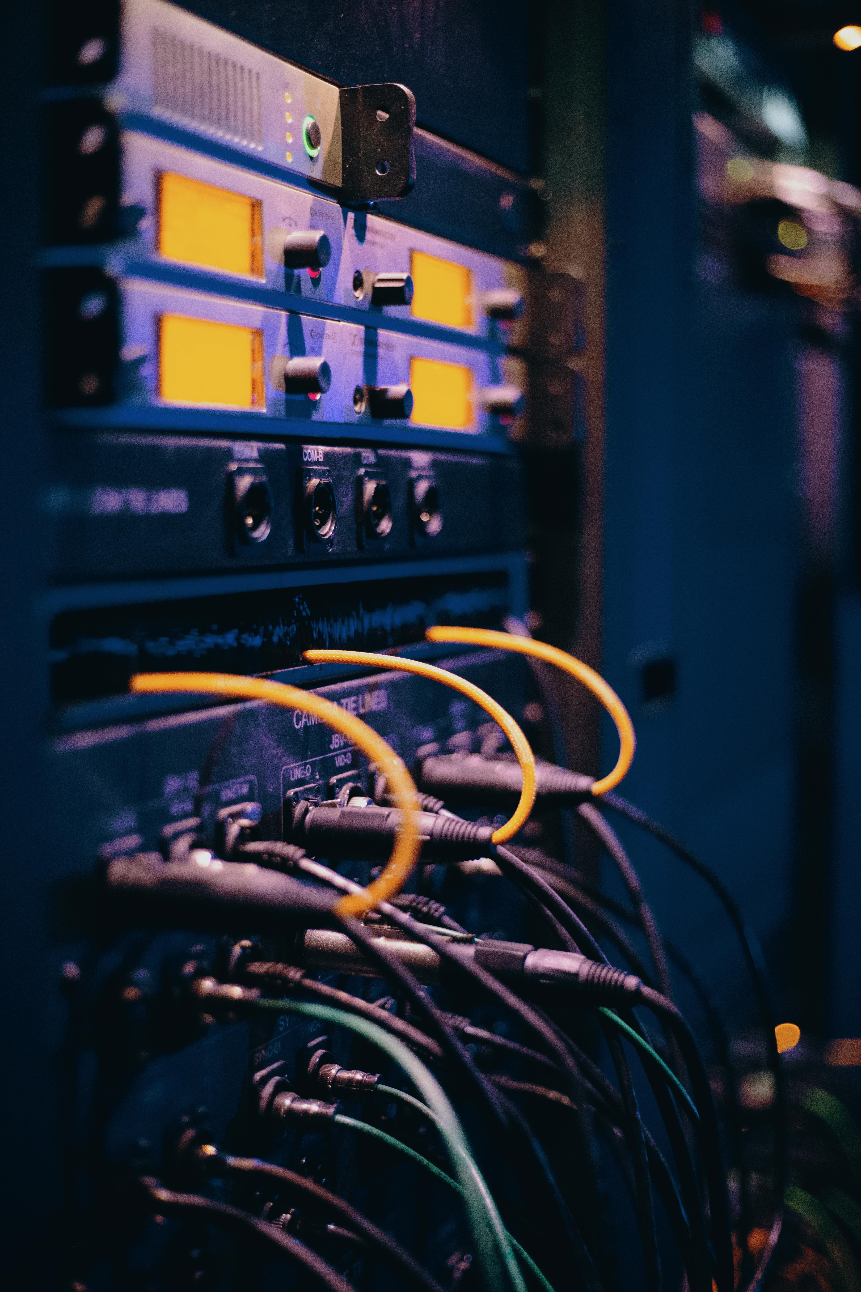 Close-up of ethernet cables connected to a server rack
