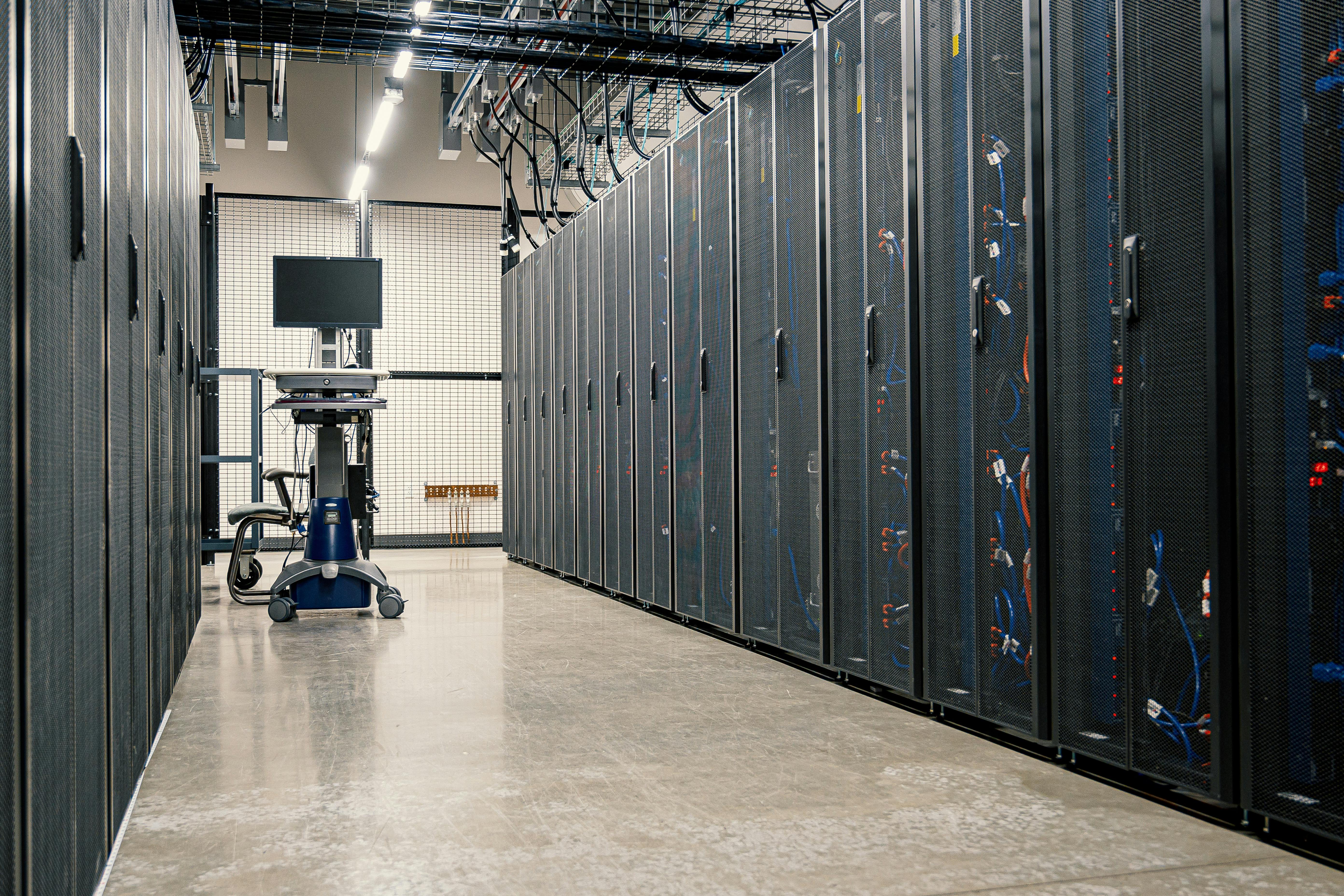 Rows of server racks inside a data center